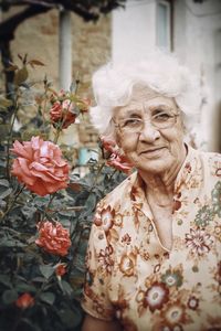 Portrait of woman with red flowers