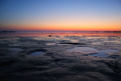 Scenic view of sea against clear sky during sunset