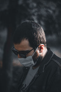 Portrait of young man wearing sunglasses standing outdoors