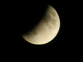 Low angle view of moon against sky at night