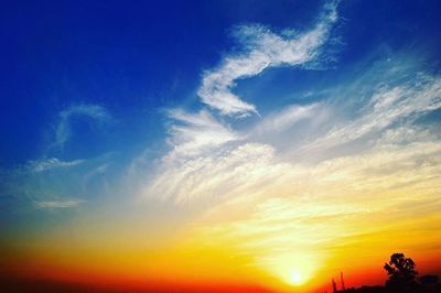 Scenic view of dramatic sky at sunset