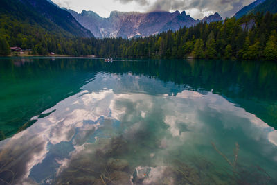 Scenic view of lake and mountains against sky