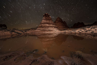 Red sandstone rock formation in remote arizona desert under a st