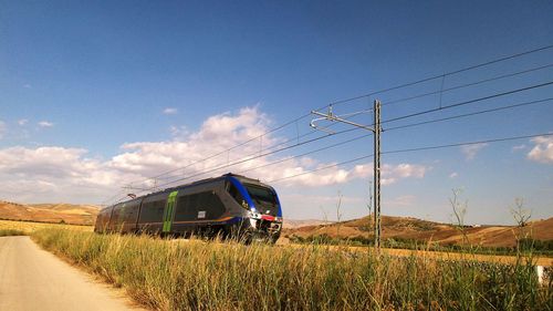 Train on landscape against sky