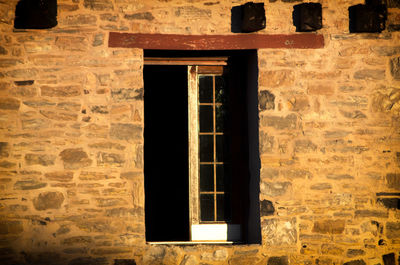 Close-up of window on brick wall
