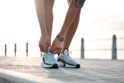 Low section of man walking on footpath