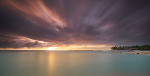 Scenic view of sea against dramatic sky