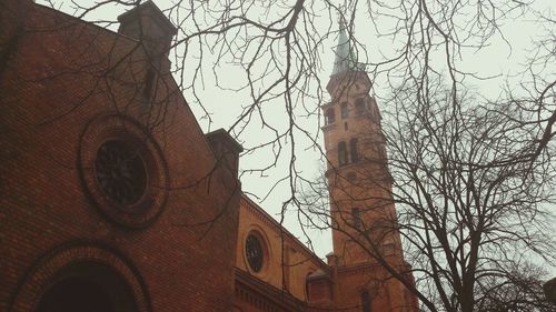 Low angle view of bell tower against sky