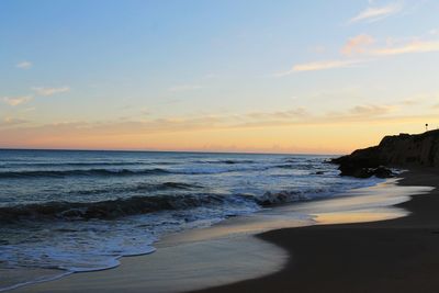 Scenic view of sea against sky during sunset