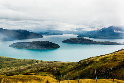 Scenic view of landscape and mountains against sky