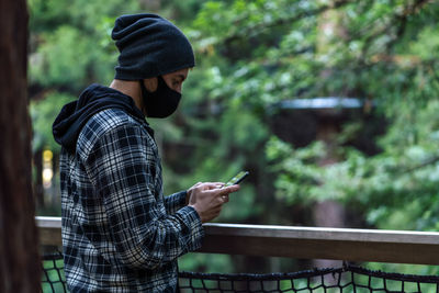 Man using mobile phone outdoors