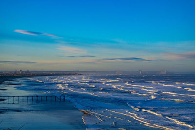 Scenic view of frozen lake against sky during winter