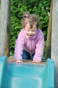 Portrait of a smiling girl playing