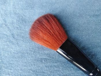 High angle view of make-up brush on table