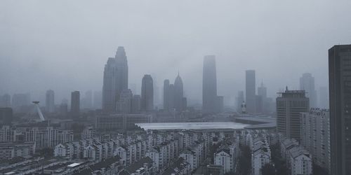 Modern buildings in city against sky