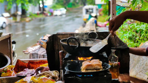 Cropped hand of man preparing food