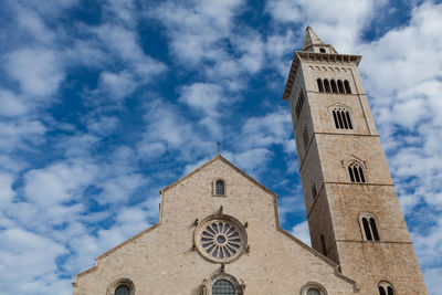 Low angle view of clock tower against sky