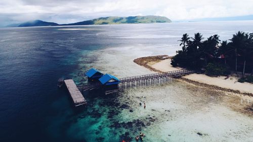 High angle view of swimming pool by sea against sky