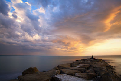 Scenic view of sea against sky during sunset