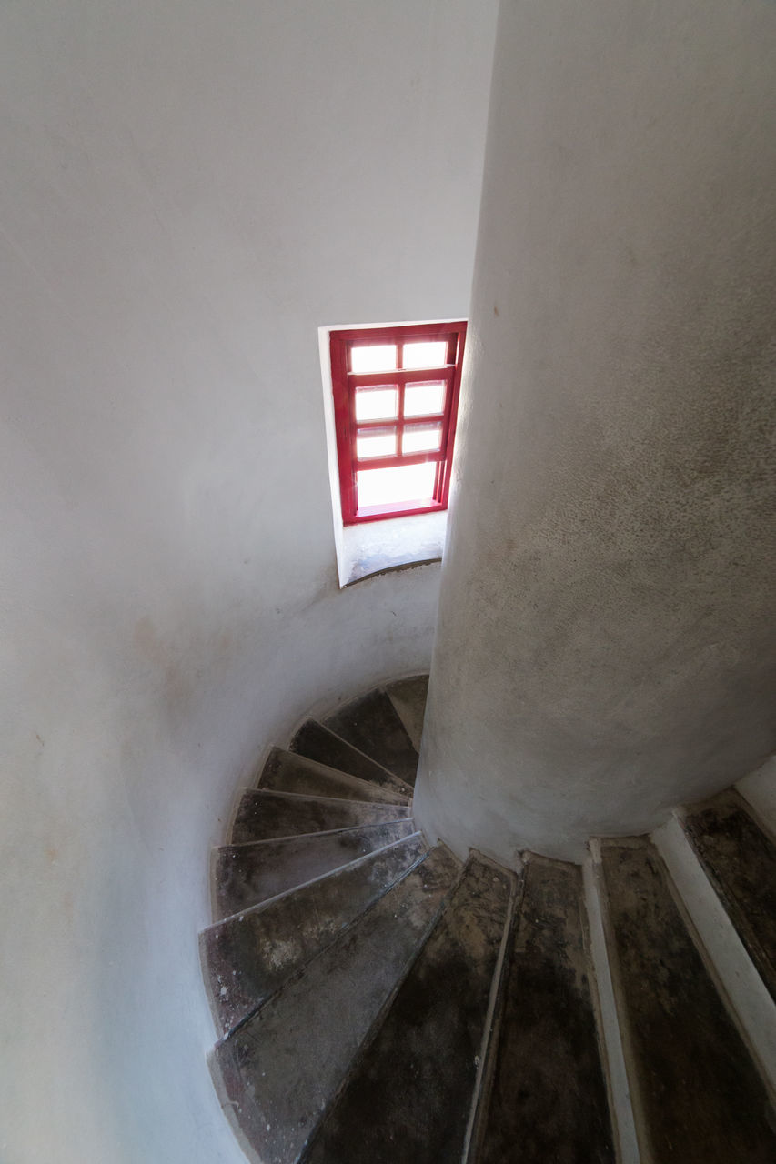 built structure, architecture, low angle view, steps, steps and staircases, staircase, building exterior, indoors, railing, wall - building feature, no people, building, day, red, high angle view, metal, clear sky, pattern, sunlight