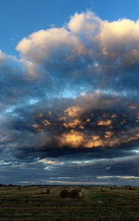 Scenic view of landscape against cloudy sky