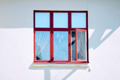 Close-up of window on white wall