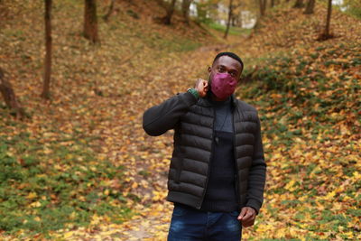 Man standing in forest during autumn