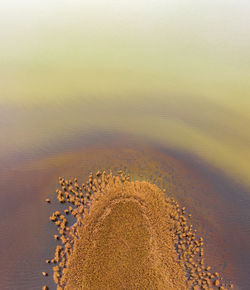 High angle view of sand on beach against sky
