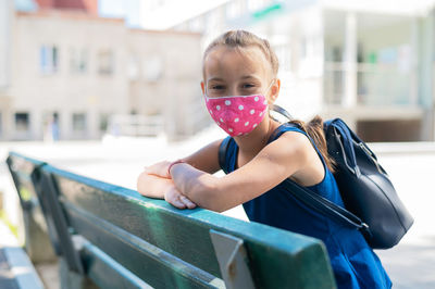 Portrait of girl standing outdoors