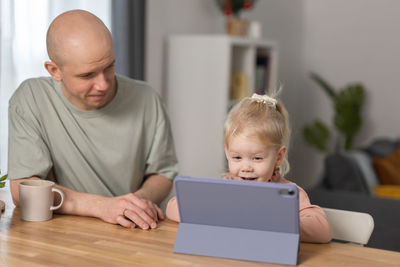 Young man using laptop at home