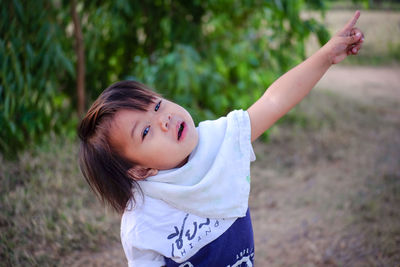 Portrait of cute girl on field