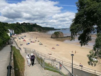 High angle view of people walking on beach