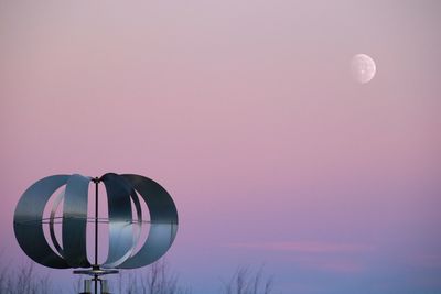 Moon against sky at sunset