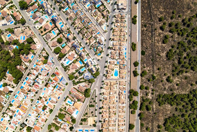 High angle view of road amidst buildings in city