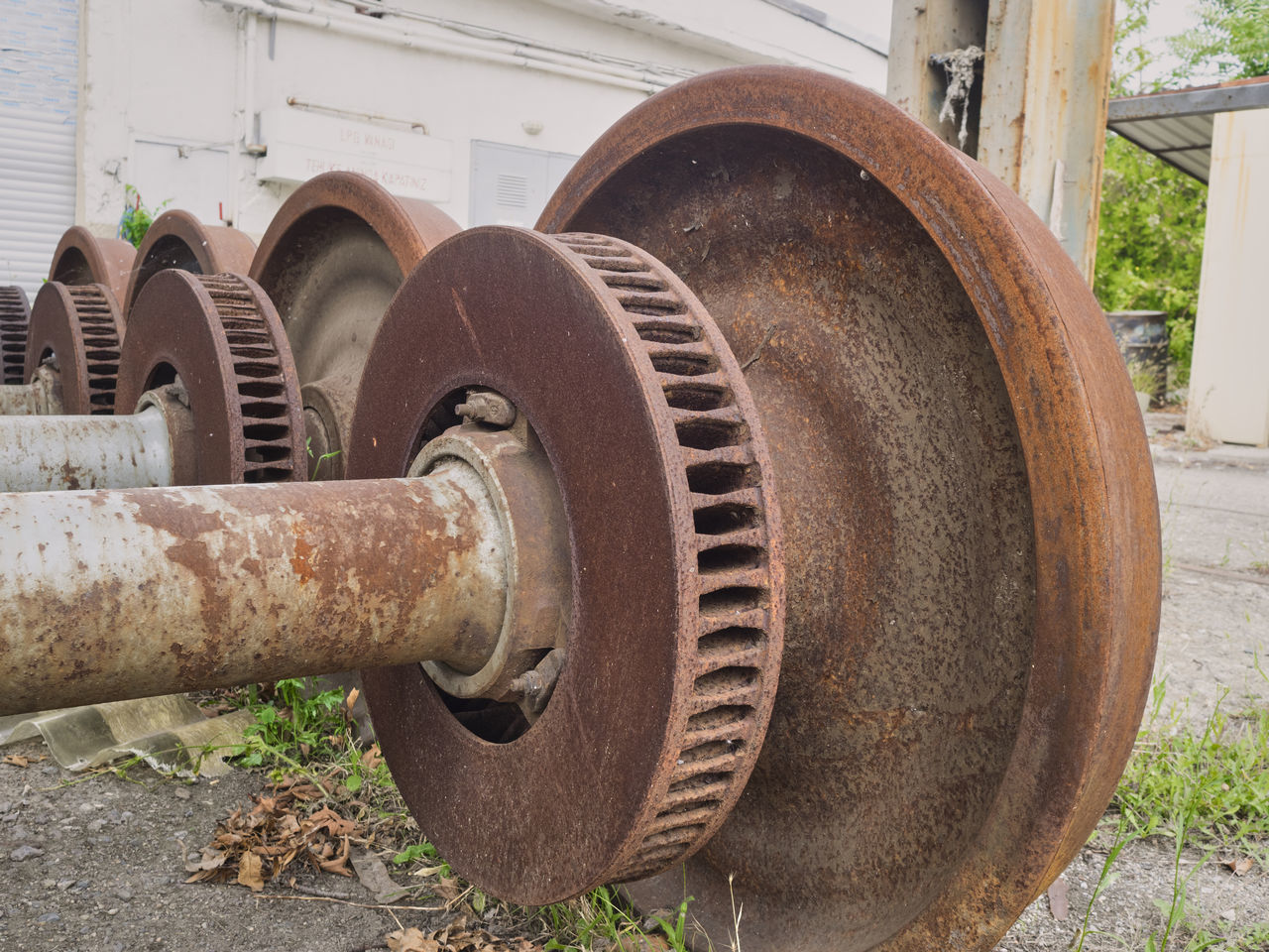 CLOSE-UP OF RUSTY MACHINE PART OF CAR