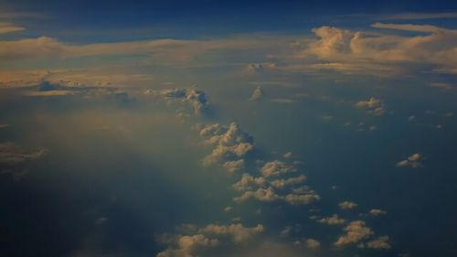 Scenic view of landscape against cloudy sky