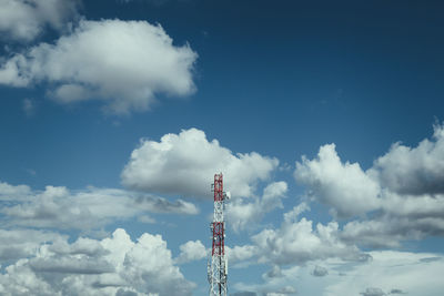 Low angle view of communications tower against sky