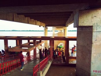 Man standing on bridge