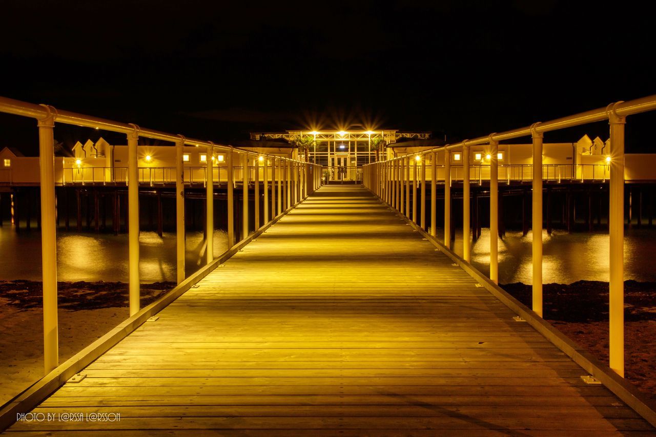 VIEW OF ILLUMINATED BUILT STRUCTURE AT NIGHT