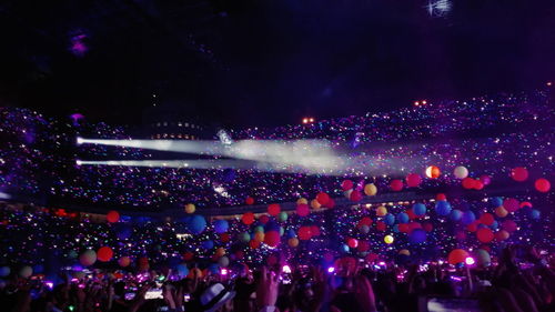 Crowd at music concert at night