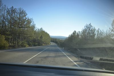 Road seen through car windshield