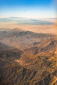 Aerial view of dramatic landscape against sky