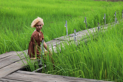 Portrait of woman on field