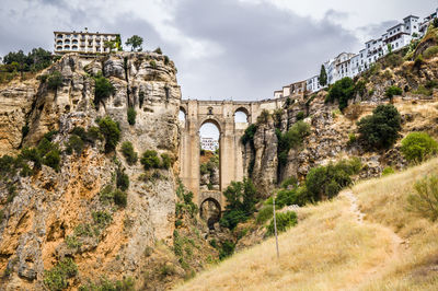 View of old ruin building against cloudy sky