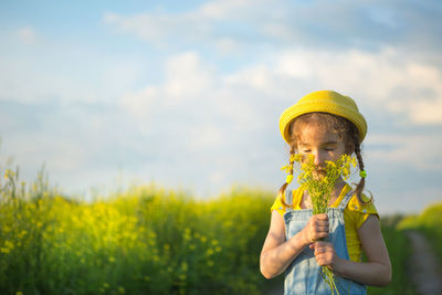 Portrait of woman holding flower