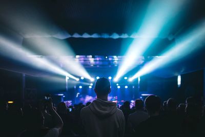 Rear view of people enjoying music concert