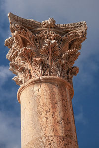 Low angle view of statue against sky