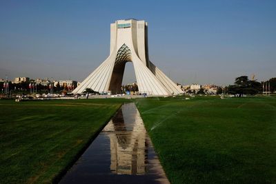 Reflection of azadi tower on water in tehran