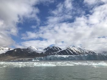 Scenic view of snowcapped mountains against sky