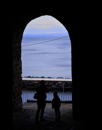 View of people walking on pier